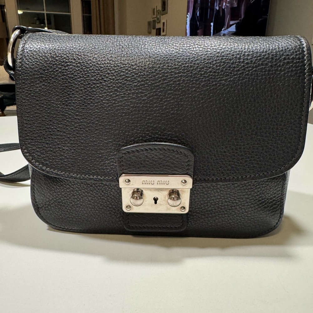 Authentic Miu Miu Black Textured Leather Crossbody Bag used in a good condition